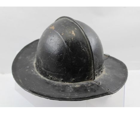 A MORION OR PIKEMAN'S POT HELMET of English 17th century design, having riveted metal construction with broad flat brim, a lo