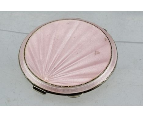 HENRY CLIFFORD DAVIS A MID 20TH CENTURY SILVER AND PINK GUILLOCHE ENAMEL POWDER COMPACT, the hinged cover with a sunburst/sca