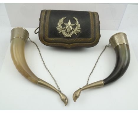 A 19TH CENTURY MILITARY LEATHER POUCH with Regimental crest, together with two decorative RUSSIAN FAUX HUNTING HORNS 
