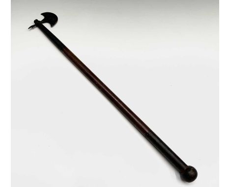 A small Indian axe, the crescent shaped blade opposed by a small spike, with wood shaft and metal handle with ball terminal, 