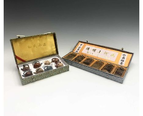 A Chinese cased set of miniature Yixing teapots and a cased set of Chinese 'Riverscene' glass snuff bottles, 20th century, he