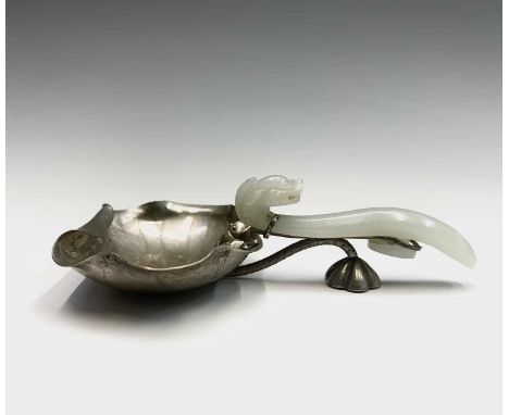 A Chinese jade and silver spoon, the bowl in the fom of a lotus flower inhabited with two frogs, the stem and lotus pod suppo