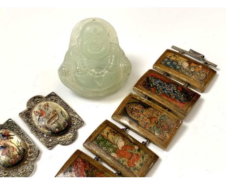 A carved jade pendant of Buddha, length 3.5cm, a Persian bone painted bracelet, length 16cm, and three Persian mother of pear