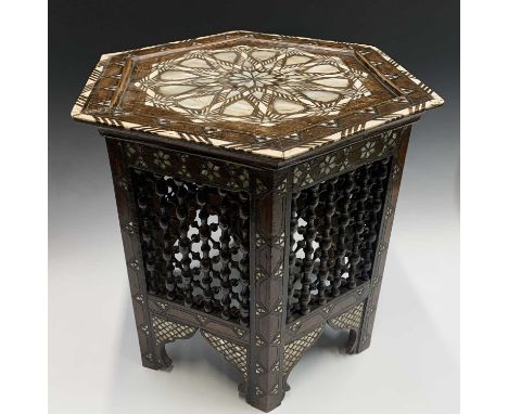 A Damascus hardwood octagonal occasional table, Syria, circa 1880, with mother of pearl and bone inlay, the base with mashrab