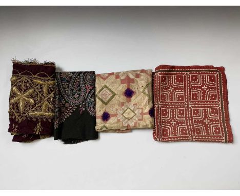 An applique work cushion front, possibly Indian, 50cm square and three other textiles.