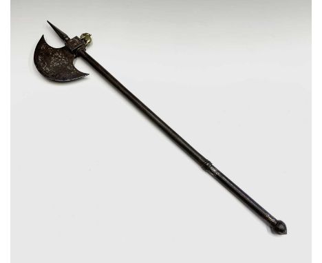 A small Indian axe, the crescent shaped blade with faint traces of decoration, square head with screw in brass elephant on th
