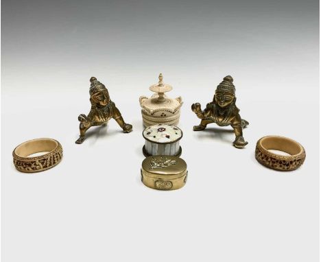 A pair of Chinese Canton ivory napkin rings, circa 1900, diameter 4.5cm, a Chinese brass snuff box and other items.