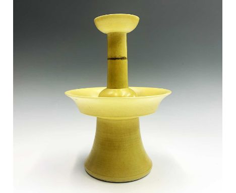 A Chinese yellow glazed porcelain candlestick holder, 18th/19th century, with a four-character Phags-pa-mark, height 28.5cm, 