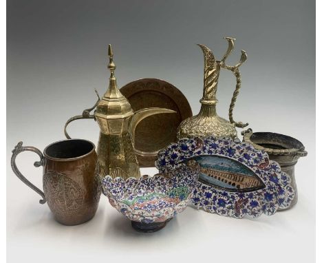 An Indian brass ewer, 20th century, the handle cast as two cobra, height 29cm, together with an Indian enamelled copper basin