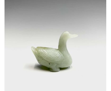 A Chinese carved jade model of a duck, height 4cm, width 5cm.