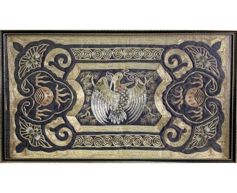 A Chinese silk embroided and gold metal thread picture, early 20th century, the central panel with a stylised bird, framed an