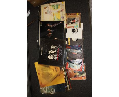 A COLLECTION OF LP RECORDS AND 7" SINGLES TO INCLUDE DAVID BOWIE, ROLLING STONES, THIN LIZZY