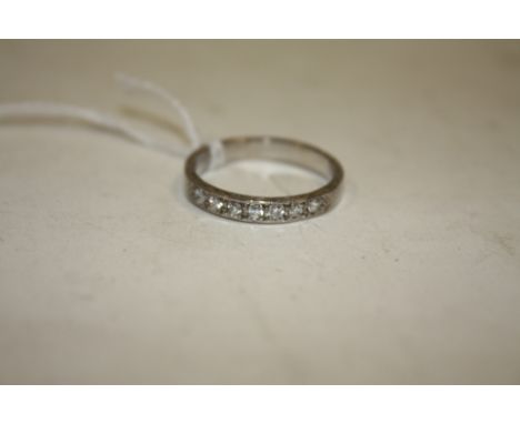 A SEVEN STONE DIAMOND HALF ETERNITY RING, ring size Q 1/2
