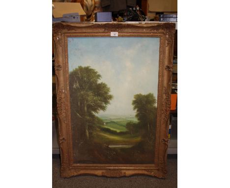 A GILT FRAMED OIL ON CANVAS SIGN R WITCHART OF A WOODED LANDSCAPE