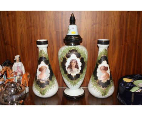A VICTORIAN STYLE FROSTED GLASS THREE PIECE MANTEL GARNITURE WITH FEMALE FIGURATIVE DETAIL (3) 