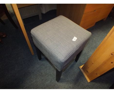 A MODERN UPHOLSTERED FOOT STOOL