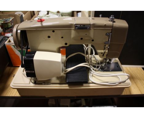 A CASED VINTAGE JONES SEWING MACHINE