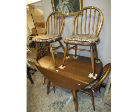 AN ERCOL DROPLEAF TABLE AND 4 HOOPBACK CHAIRS