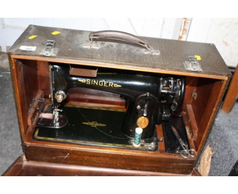 A CASED VINTAGE SINGER SEWING MACHINE