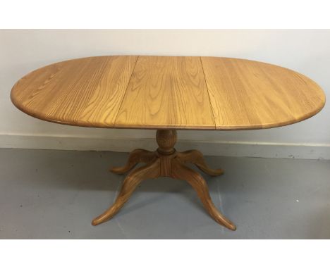 ERCOL CHESTER TABLE. An extendable Ercol 'Chester' table design #1117 with cover. Measures approx 73 cm tall, 149cm lengthway