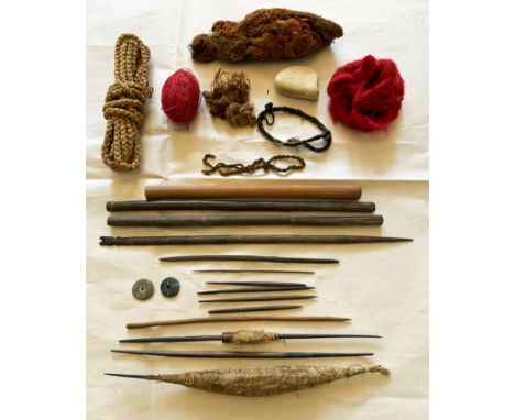 A collection of Chancay weaving implements and textile remnants from Peru, ca. 1100 - 1450 AD. It consists of various spindle