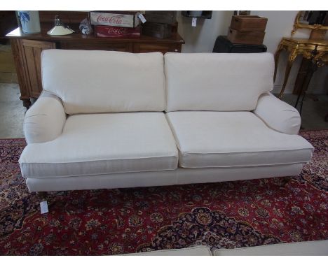 A two seater sofa in an off white fabric - Width 2m x Depth 96cm x Height 90cm - only 2 years old