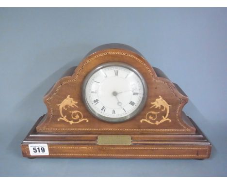 An Edwardian mahogany and inlaid mantle clock