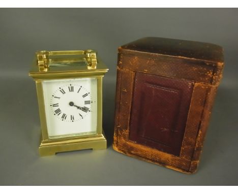 A brass carriage clock with leather travel case and key - Height 11cm Condition report: Working, chip to back glass, some cle