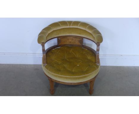 A late 19th early 20th century tub chair with inlay to arms, splat frame, upholstered in green fabric with button seat raised