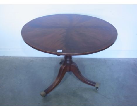 A mahogany antique style round table on a tripod base - Height 76cm x Diameter 91cm