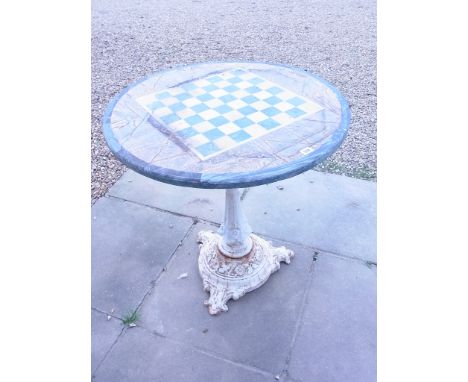A cast Iron Garden table with a later marble Chess board top - Height 78cm x Diameter 76cm 