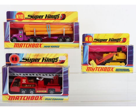 Three Matchbox SuperKings, K-8 Caterpillar Traxcavator, yellow/orange, K-9 Fire Tender, red body, silver ladder/interior and 