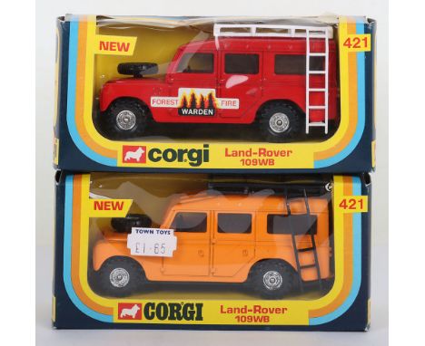 Two Corgi  421 Land-Rover 109WB models, red body, ‘Forest Fire Warden’ labels, tan interior, white roof rack/ladder and orang