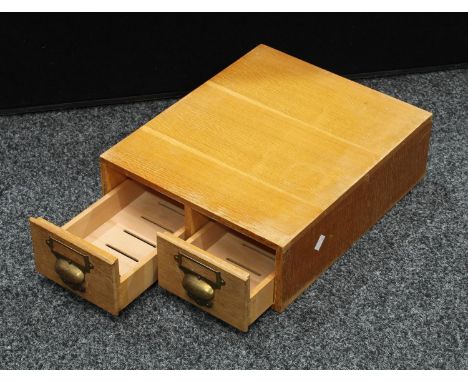 A mid-20th century light oak two-drawer desk top filing cabinet 