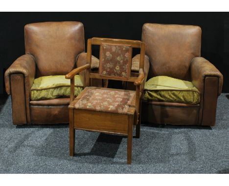 A pair of 1940s brown leatherette upholstered arm chairs, a Victorian commode chair (3) 