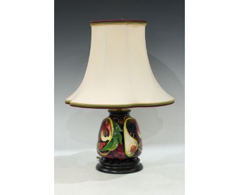A contemporary Moorcroft table lamp, applied with figs and pomegranates,  17cm ( 42cm overall) 