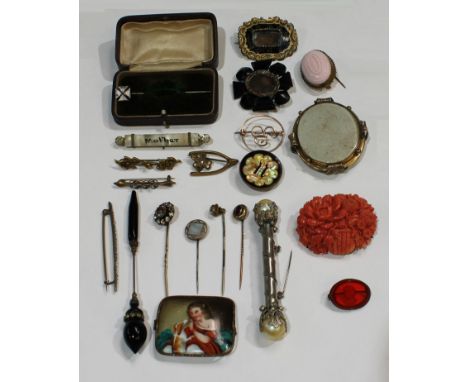 Jewellery - a carved coral brooch in relief with an arrangement of flowers, 5cm wide; a mourning brooch, other 19th century b