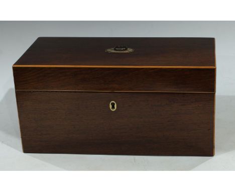A Regency mahogany rectangular tea caddy, outlined with boxwood stringing, central silvered loop handle, fitted interior with