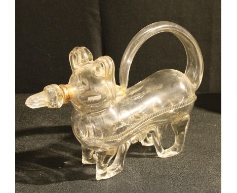 A late 19th/early 20th century novelty glass decanter in the form of a dog with stopper, 30cm long 