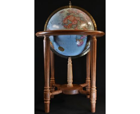 A Replogle World Classic Series 12" diameter terrestrial globe, the hardwood stand in George III style with turned and fluted