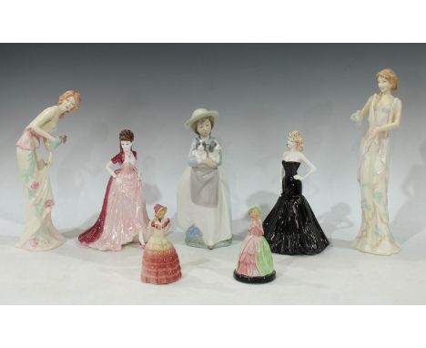 A Coalport Ladies of Fashion, Margaret and Joanne figurine of the year 2001, no 294; a Nao by Lladro figure of a girl holding