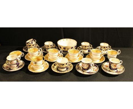 Five Daniels coffee cups, teacups and saucers, pattern 4129, banded in salmon and applied in gilt with folaite,  scrolls, gad