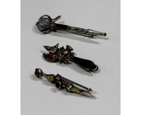 An early 20th century Scottish agate hardstone claymore sword brooch, marked C.M &amp; Co, sterling;  others dress dirk &amp;