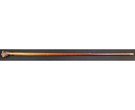 An early 20th century Black Forest automaton walking cane, the handle carved as the head of a dog, malacca shaft, 95.5cm long