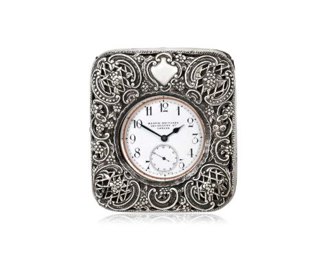 the case shaped oblong, the hinged cover with openwork mounts, with leather easel back. the watch with Arabic numerals on the