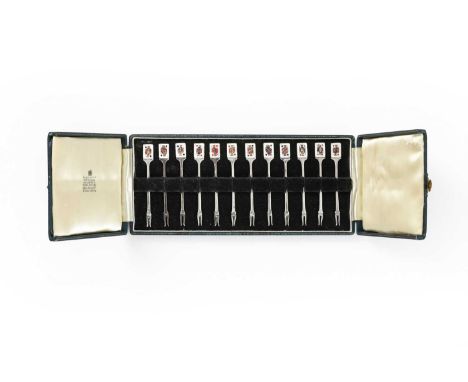 the terminal of each enamelled with a differing face card from a deck of playing cards, in fitted double-hinged casethe case 
