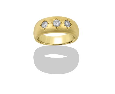 A Diamond Three Stone Ringthe graduated round brilliant cut diamonds in yellow star settings, to a plain polished shank, tota