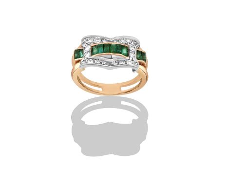 An Emerald and Diamond Ringa row of baguette cut emeralds in yellow channel settings, to a buckle motif set throughout with e