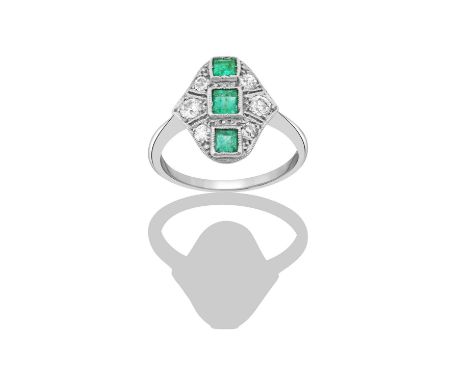 An Emerald and Diamond Ring, first quarter 20th century three graduated square cut emeralds aligned up the finger, in white m