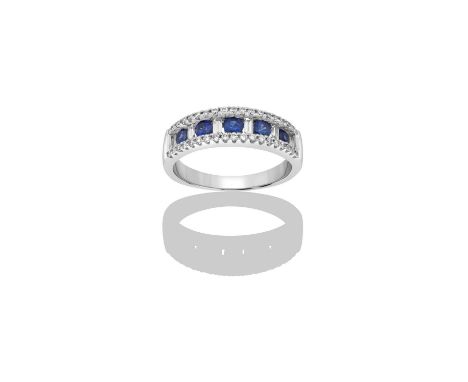 A Sapphire and Diamond Half Hoop Ringfive round cut sapphires alternate with six baguette cut diamonds, flanked by rows of ro